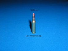 Load image into Gallery viewer, 4.6 x 30mm with a Red Tip bullet.