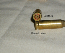 Load image into Gallery viewer, 4.6 x 30mm with a Red Tip bullet.